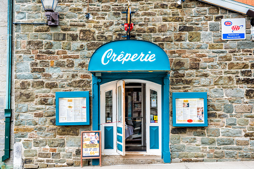 Quebec City: Creperie restaurant building in upper old town with menu and blue decoration