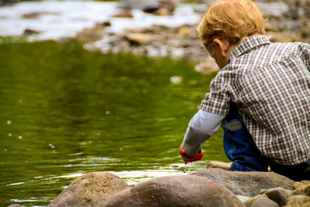 istock Happy Child in Nature by River 831499454
