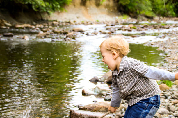 istock Happy Child in Nature by River 831499660