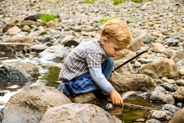 istock Happy Child in Nature by River 831502336
