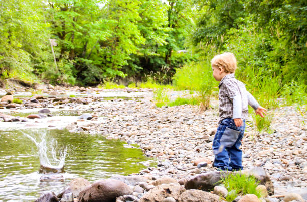 istock Happy Child in Nature by River 831502558