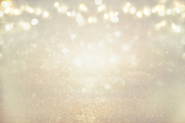 istock glitter vintage lights background. silver and light gold. de-focused 831502714