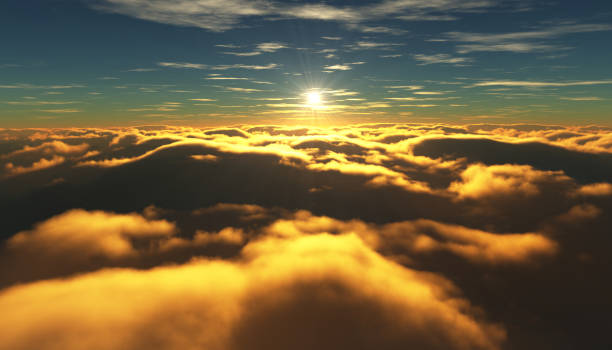 istock View of a cloudy sunrise while flying above the clouds. 831505514