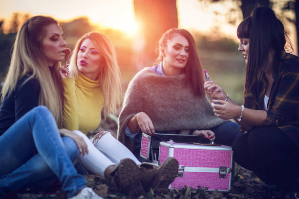 istock Friends sitting in park on a fall day 831505670