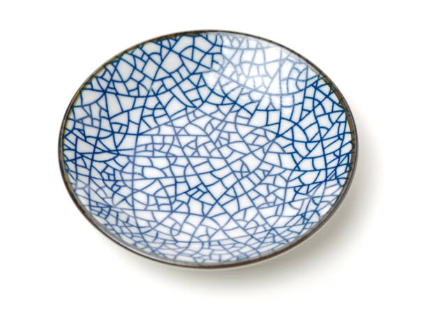 istock Ancient blue and white porcelain plate on the white background 831505896