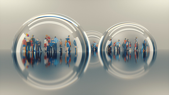 Group of people living in separate glass bubbles.