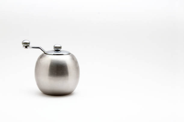 istock Metal salt and pepper shakers on white background 831509140