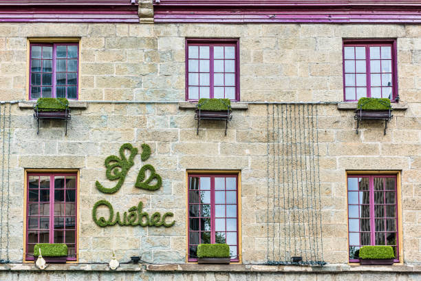 Quebec City: J'aime Quebec sign on wall in green grass lettering with heart