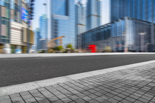 istock City empty road with modern buildings background 831509288