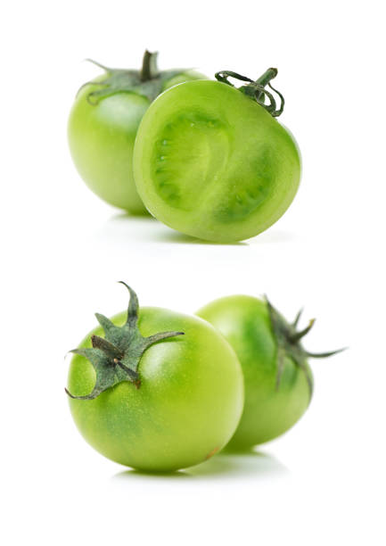 istock Green tomatoes Isolated  on White Background 831511560