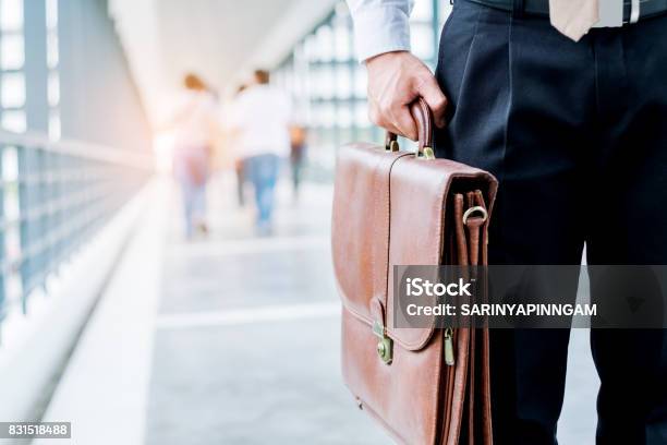 Businessman Holding A Briefcase Travellers Walking Outdoors Stock Photo - Download Image Now