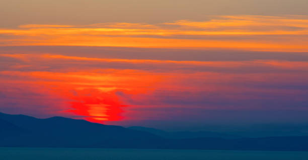 istock beautiful fiery sunset over the sea 831521534