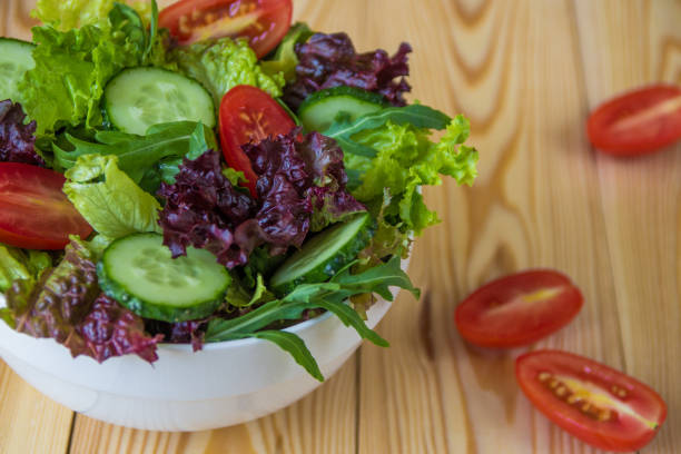 istock Fresh salad with mixed greens, cherry tomato and cucumber 831525202