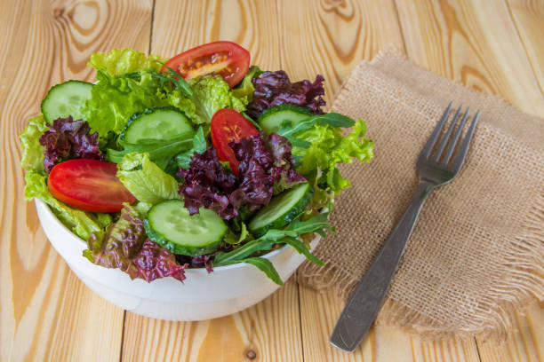 istock Fresh salad with mixed greens, cherry tomato and cucumber 831525276