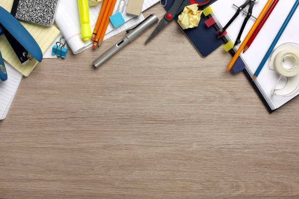 istock Desk cluttered with office supplies 831537496