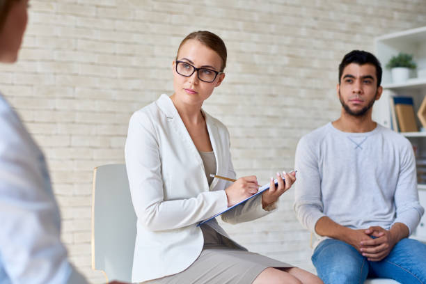 istock Beautiful Female Psychologist Leading Therapy Session 831537642