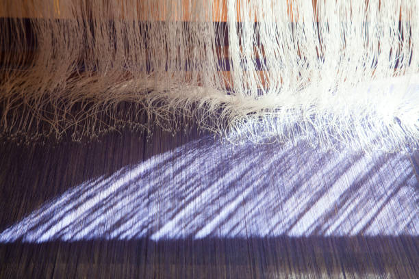 istock old weaving Loom and thread of yarn. 831537942