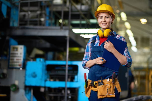 istock Smiling Female Worker at Factory 831540324