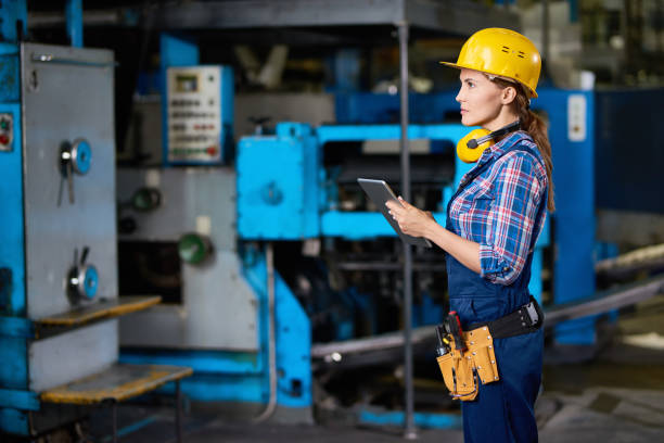 istock Female Technician Checking Machines at Factory 831540338