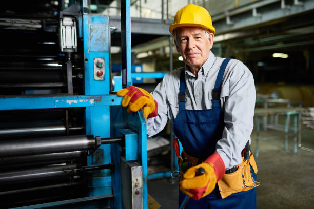 istock Senior Man operating Machines at Factory 831540474