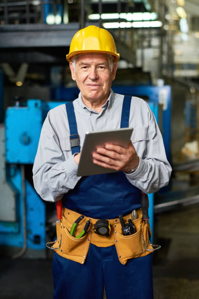 istock Senior Man Working at Modern Factory 831540478