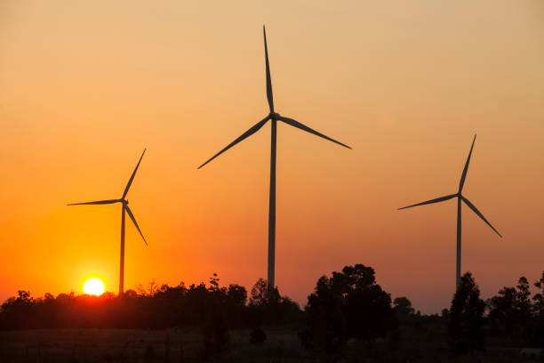 istock wind turbine sunset background ecosystem vintage 831540480