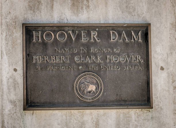 Memorial plaque in honor of workers and builders of the Hoover Dam Boulder City, Nevada, USA - June 19, 2017: Memorial plaque in honor of workers and builders of the Hoover Dam in Nevada and Arizona. US Tourist Attraction - The Hoover Dam Hydropower Station on the Colorado River hoover dam statues stock pictures, royalty-free photos & images