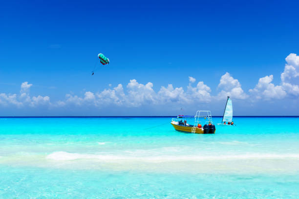 istock Flying parasailing in a blue sky Watersport concept. 831546842