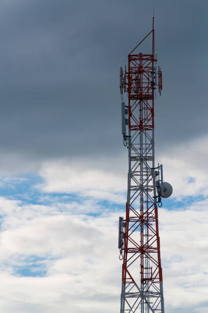 istock Antenna of cellular and communication system tower with the blue sky and cloud. 831548484
