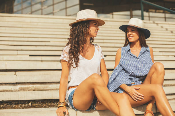 istock Smiling women relaxing outdoors 831551590