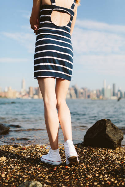 istock Woman by the river in NYC, Williamsburg 831553920
