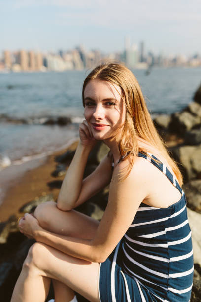 istock Woman by the river in NYC, Williamsburg 831554018