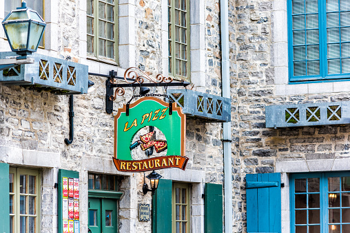 Quebec City: Lower old town street La place Royale with closeup of La Pizz restaurant sign
