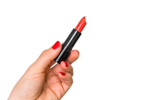 istock Female hand with red lipstick isolated on white 831555198