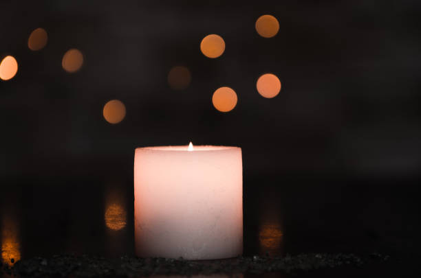 istock Moody candlelight with a nice fuzzy light bokeh. Perfect for the spa. 831558456