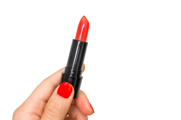 istock Female hand with red lipstick isolated on white 831558670