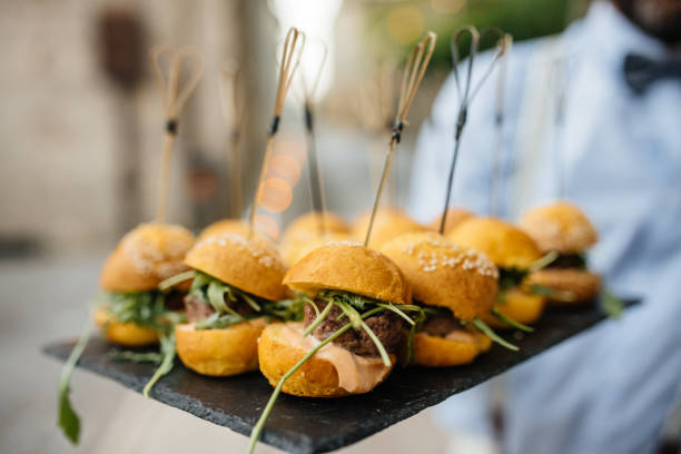 istock mini hamburger with salad leaf served on the plate on restaurant table 831558972