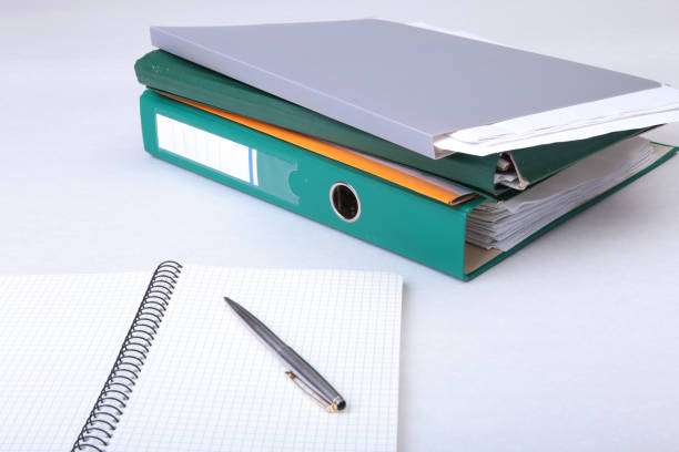 istock Folder file, note and pen on the desk. blurred background. 831559118