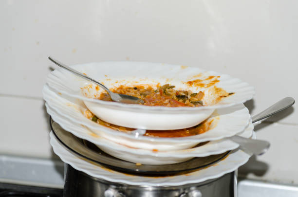 istock Heap of dirty dishes in the kitchen 831559130