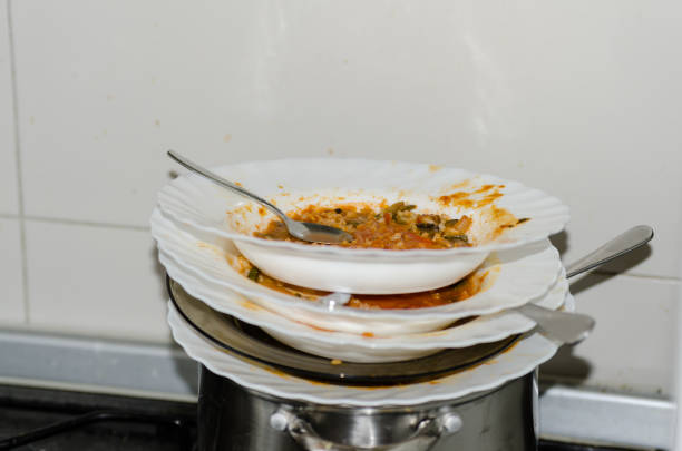 istock Heap of dirty dishes in the kitchen 831559190