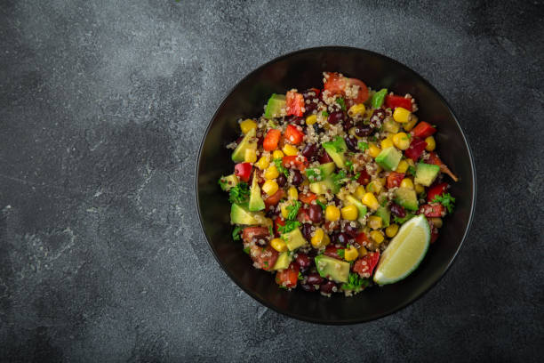 Avocado, quinoa, bean, corn and bell pepper salad