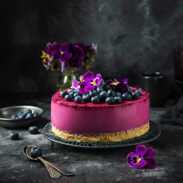 no baked blueberry mousse cake on dark background