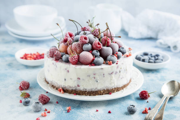 vanilla ice cream cake with frozen berries vanilla ice cream cake with frozen berries , selective focus yogurt photos stock pictures, royalty-free photos & images