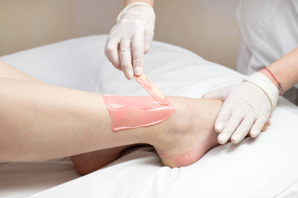 istock Process depilation female legs and hands 831563302