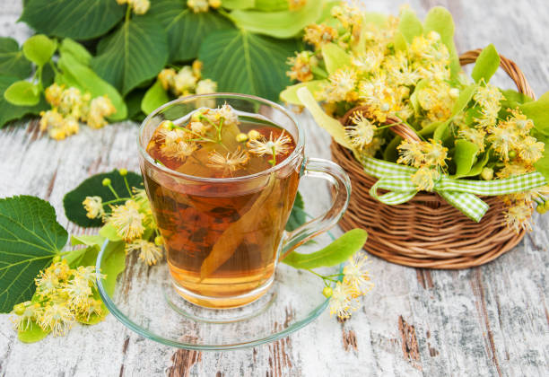 istock cup of herbal tea with linden flowers 831570374