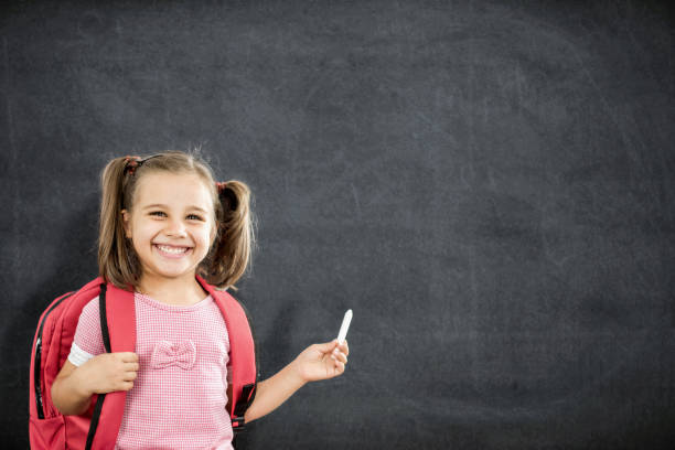 istock Back To School Concept, Happy Smiling Schoolgirl Studying 831571270