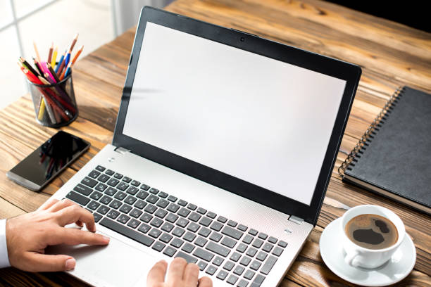 istock Laptop Computer Monitor With White Screen In Office 831572100