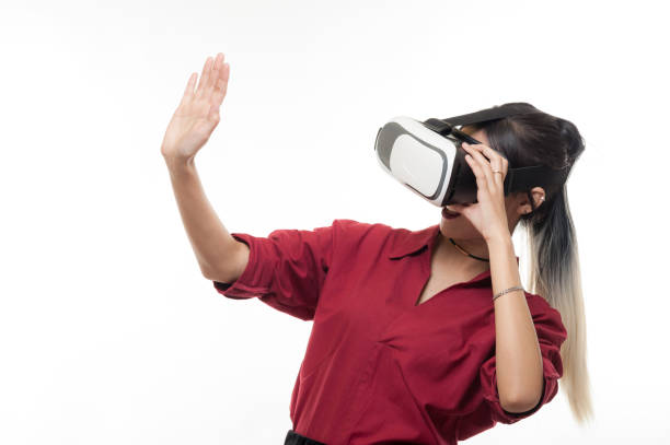 istock Young Asian woman preparing to use VR glasses 831581476