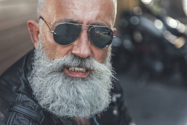 istock Cheerful smiling elder man in sunglasses 831582276