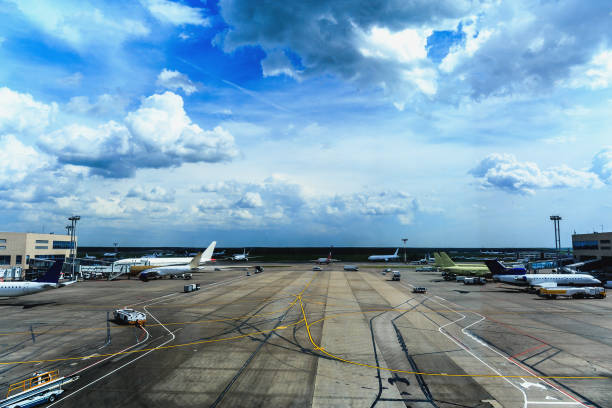 istock Airport with airplanes and beautiful cloudy sky 831585886